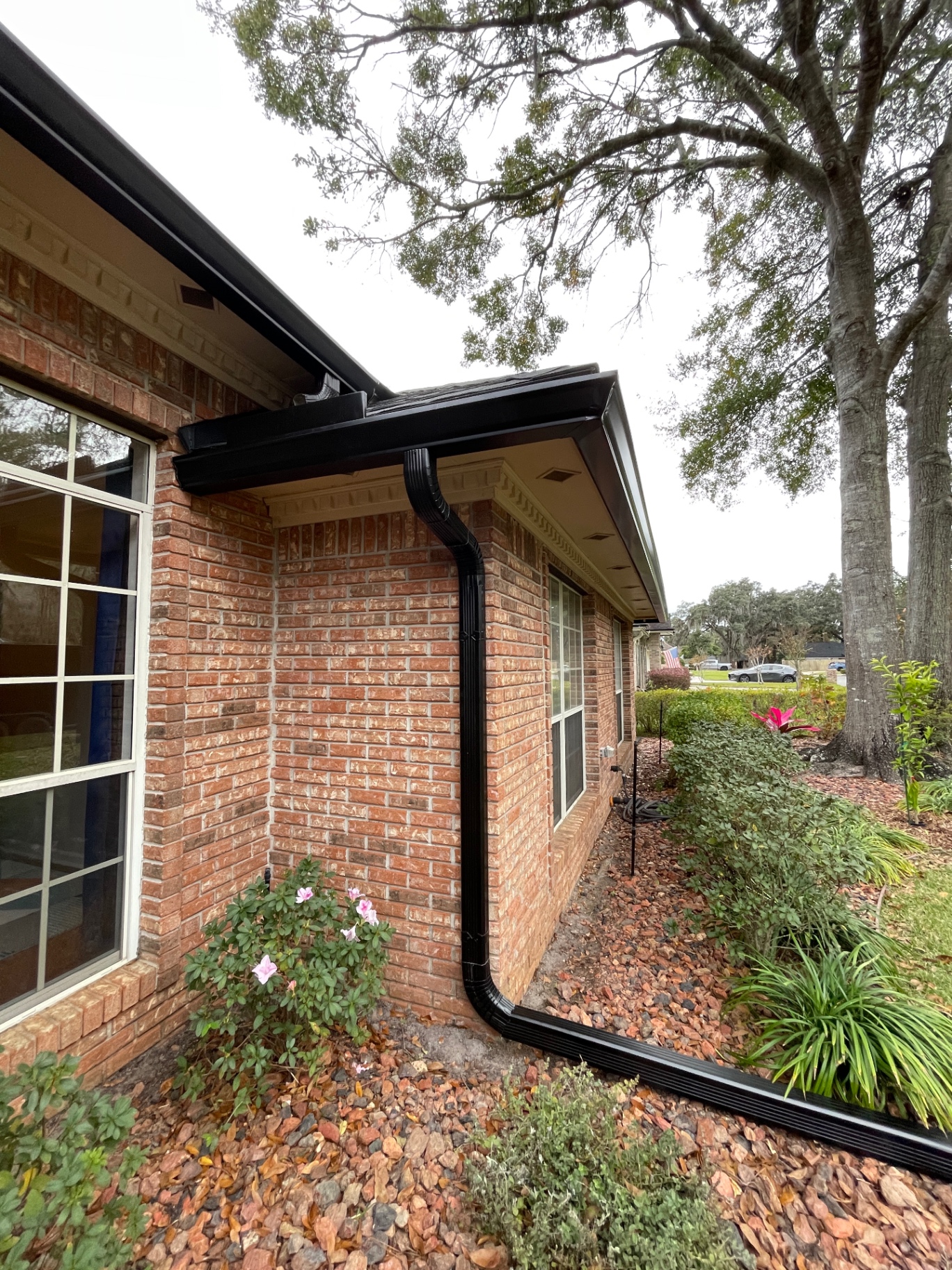 Matte black gutters · coastal home